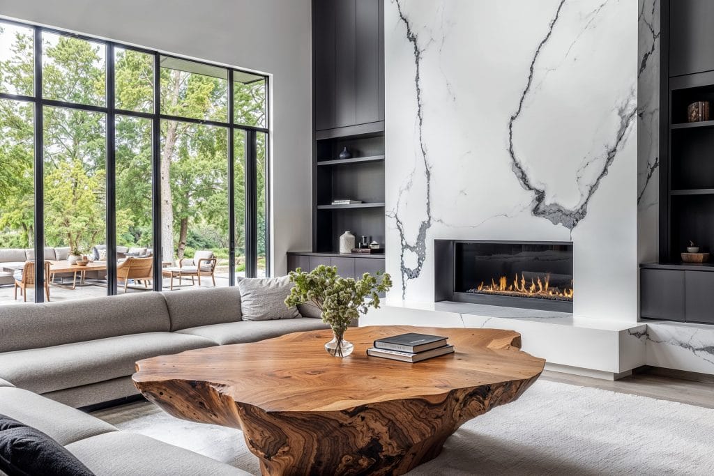 An airy living room layout with a statement fireplace, by Decorilla