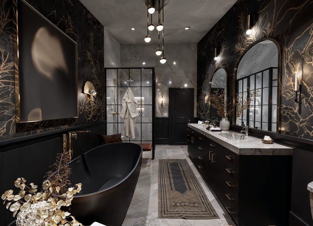 Designer wallpaper enhancing luxury vibes in a moody bathroom by Decorilla designer Lauren O.