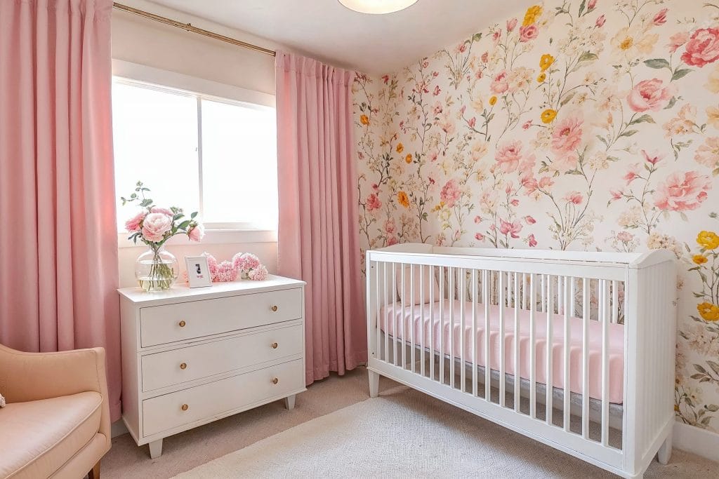 Gentle floral designer wallpaper in a nursery by Decorilla