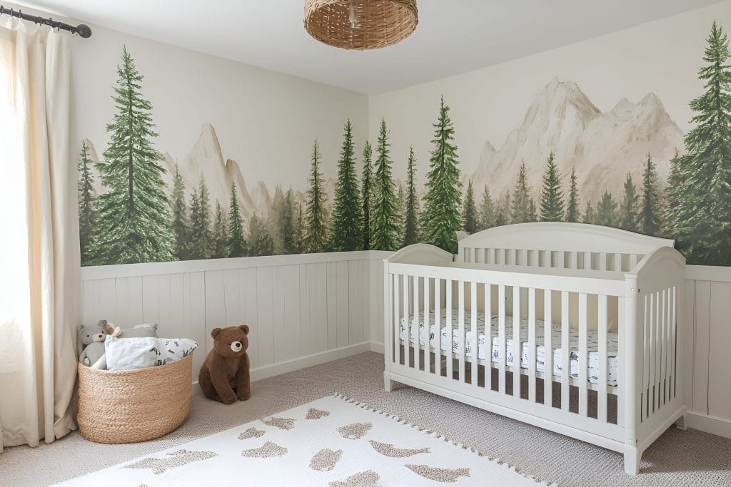 Forest wallpaper in a nursery by Decorilla