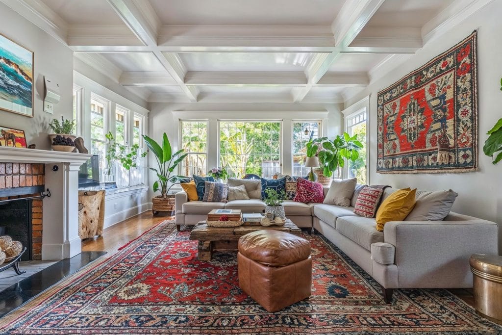 Balanced maximalism in a living room layout by Decorilla