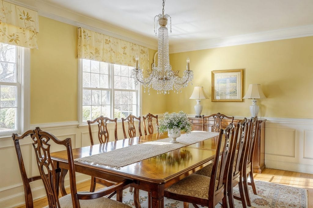 Butter yellow traditional dining room design by Decorilla