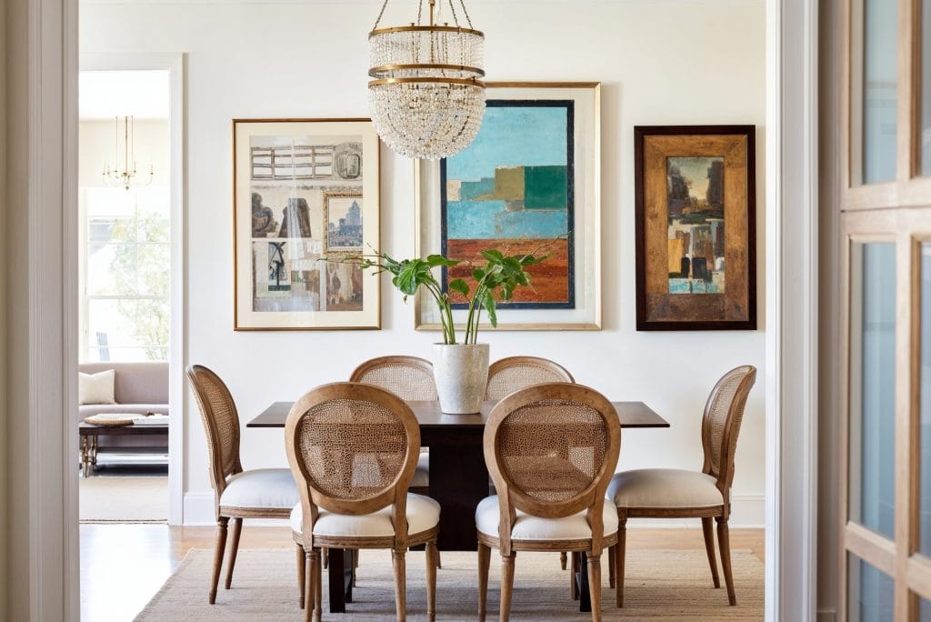 Art and interior design styles blended in a dining room by Decorilla