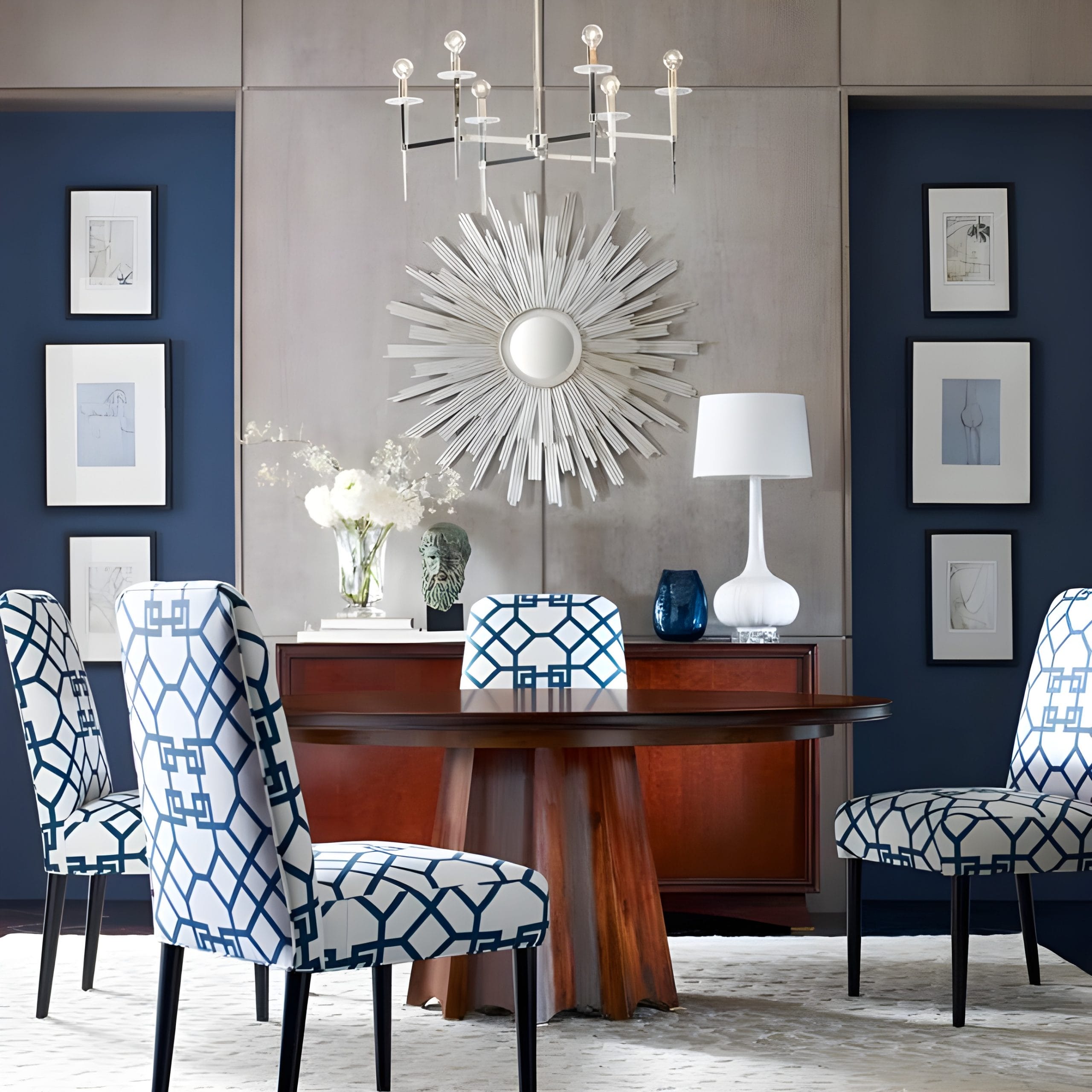 Use art in interior design to achieve symmetry like in a dining room by Decorilla