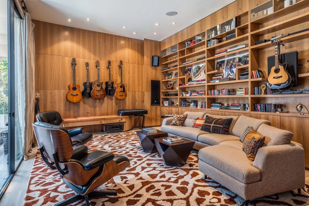 A music room in a walkout basement by Decorilla