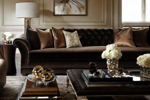 Luxurious dark brown sofa living room by Decorilla