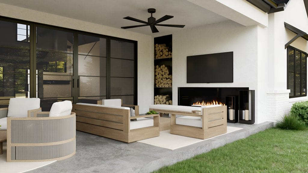 Backyard patio design with multifunctional furniture and a fireplace wall by Decorilla