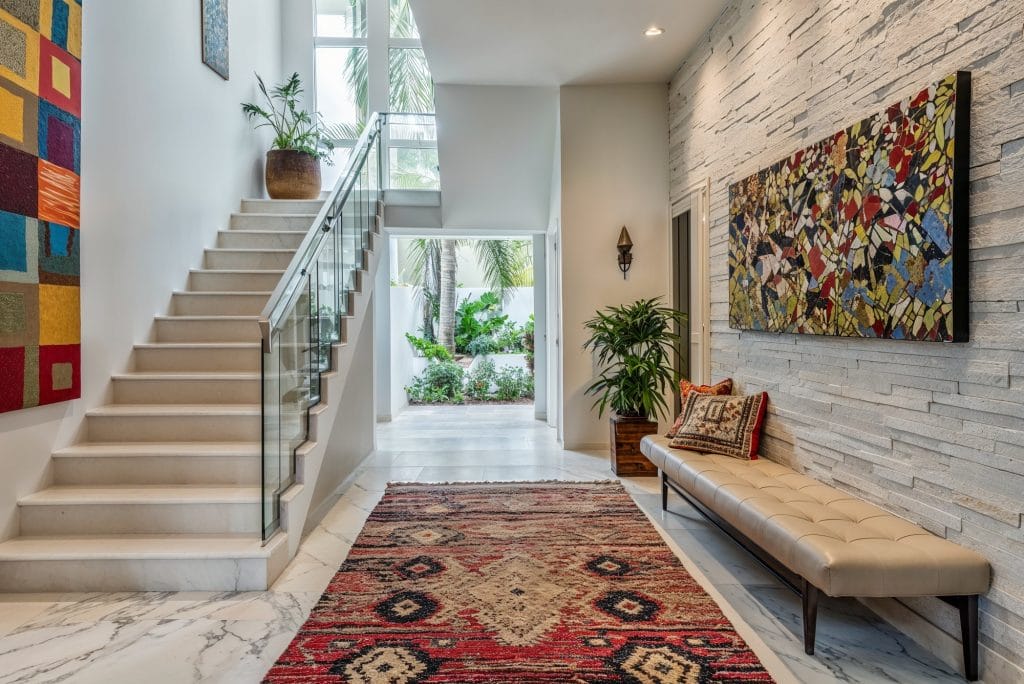 Textured walls in a hallway following the 2025 interior design trends by Decorilla