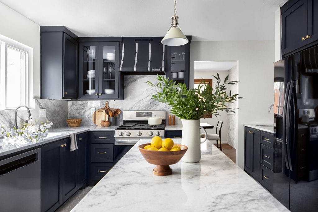 Chic kitchen with refinished cabinets demonstrating the budget kitchen remodel by Decorilla