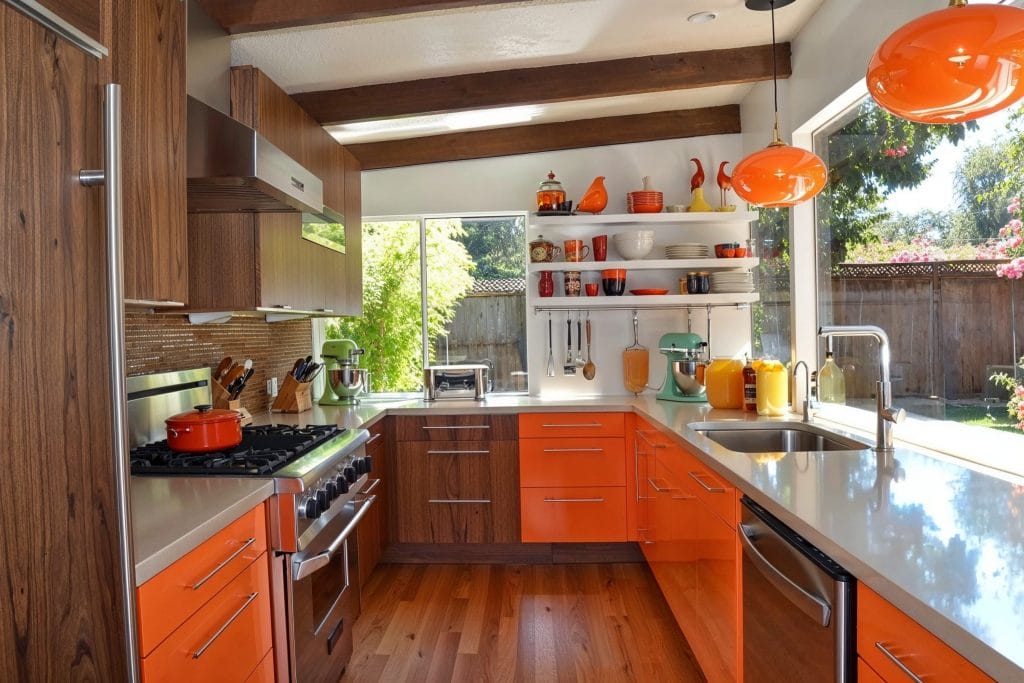 Colorful tiny kitchen with bold backsplash and compact appliances by Decorilla