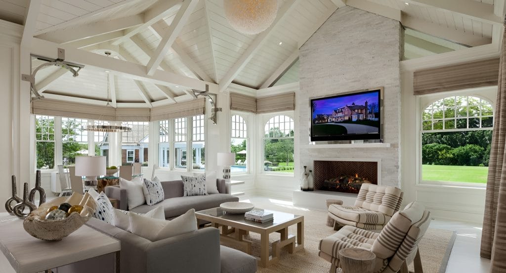 Entertainment zone in a sunroom interior by Decorilla designer, Tammy M.