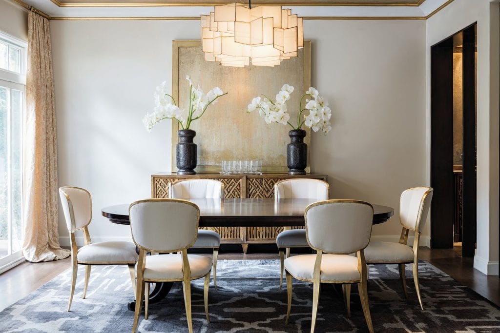 Glamorous dining room lighting by DECORILLA