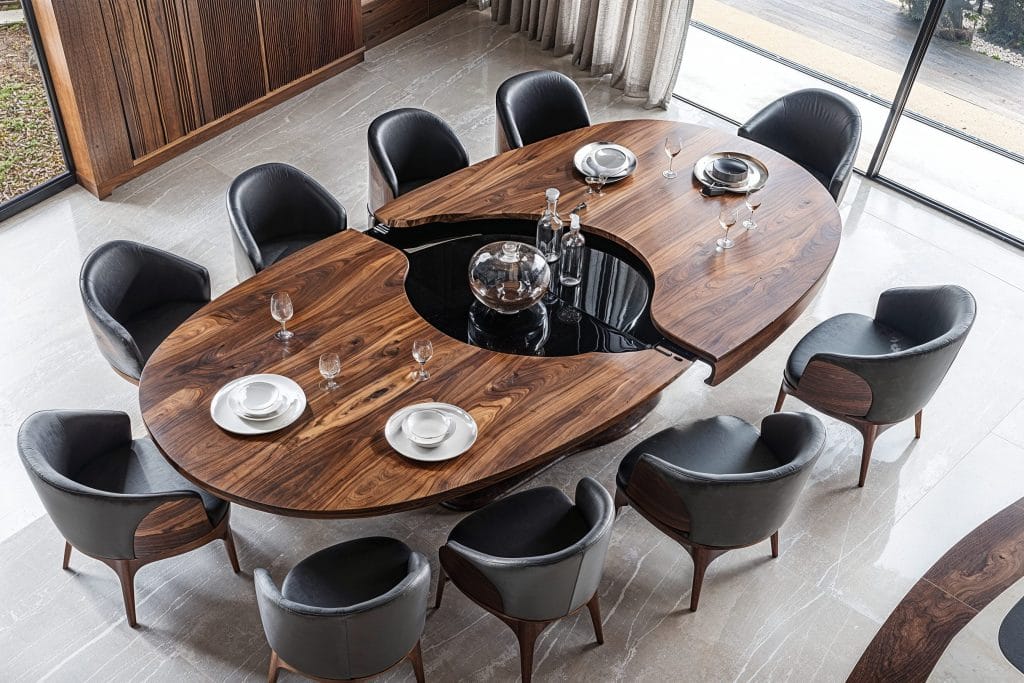 High-end dining room with expandable table by Decorilla