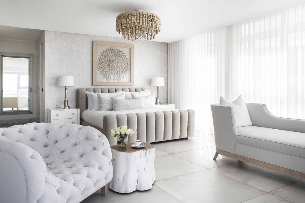 Modern neutral bedroom with coastal glam vibes by Decorilla