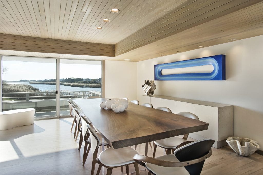 Statement art in a modern dining room by Decorilla designer, Peter C. 