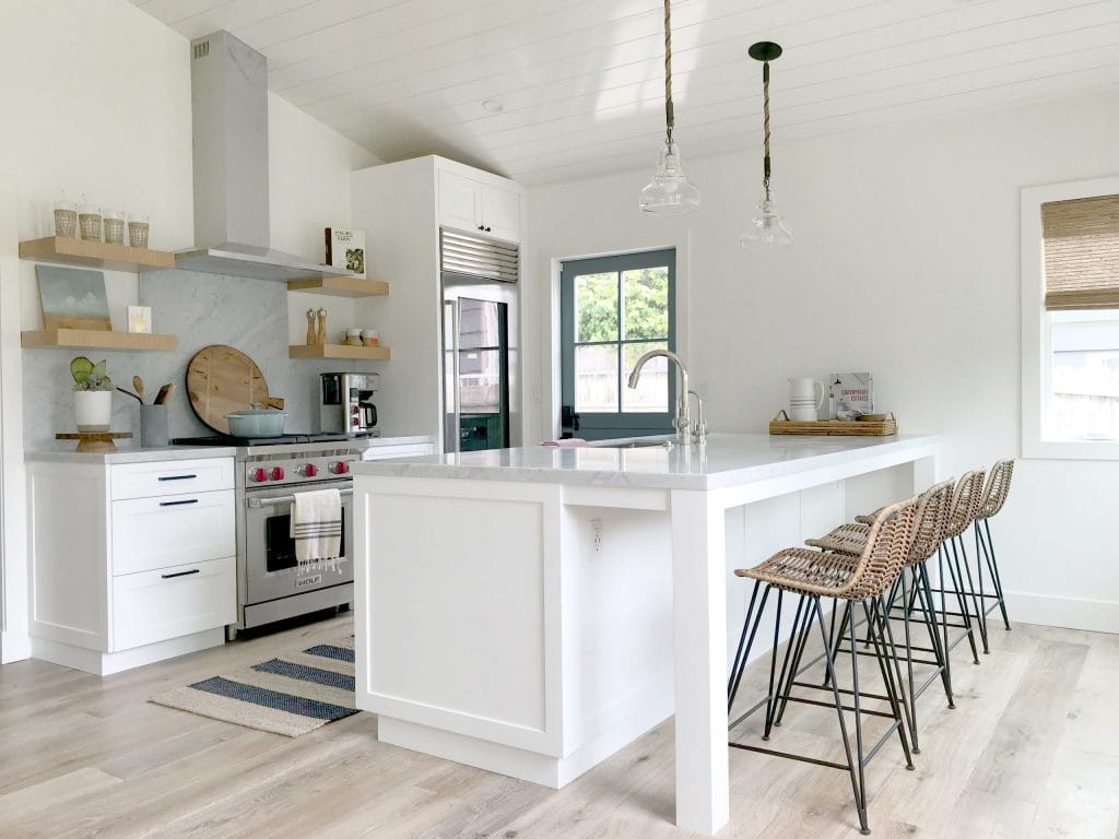 A contemporary kitchen with seamless wood floor tiles, by Decorilla