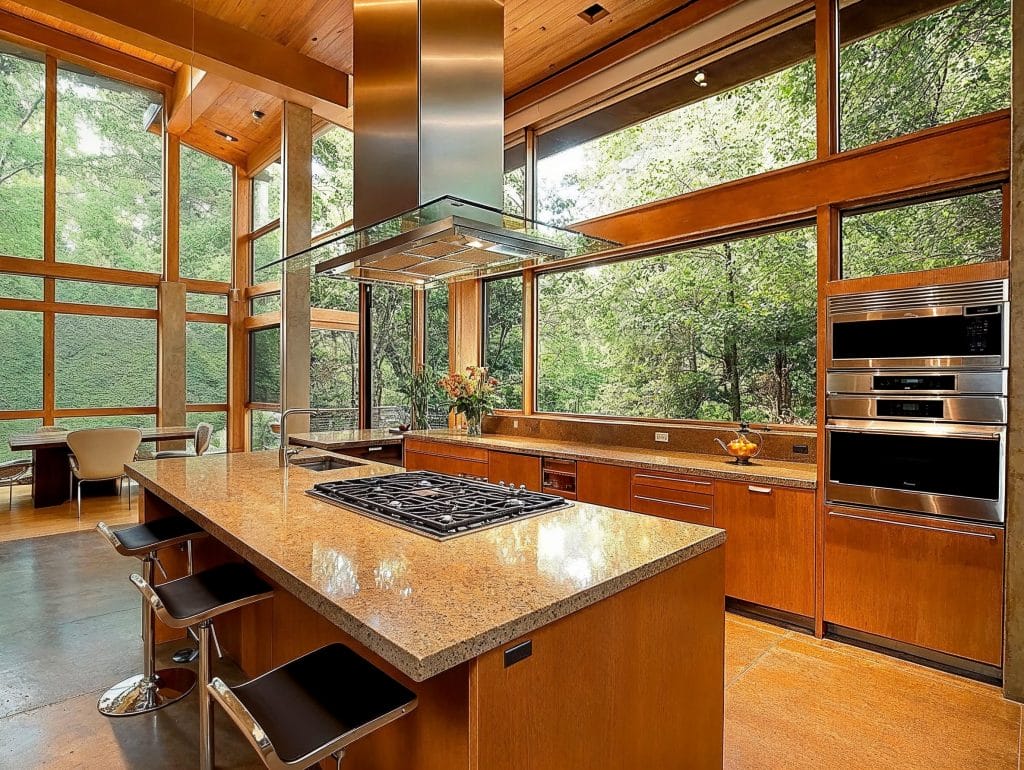 Mid-century modern kitchen with glass range hood by Decorilla