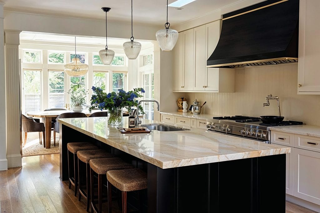 Modern kitchen with black decorative hood vent by DECORILLA