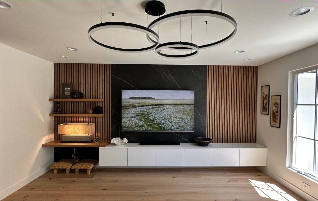 Modern minimalist living room with a custom entertainment wall by Decorilla