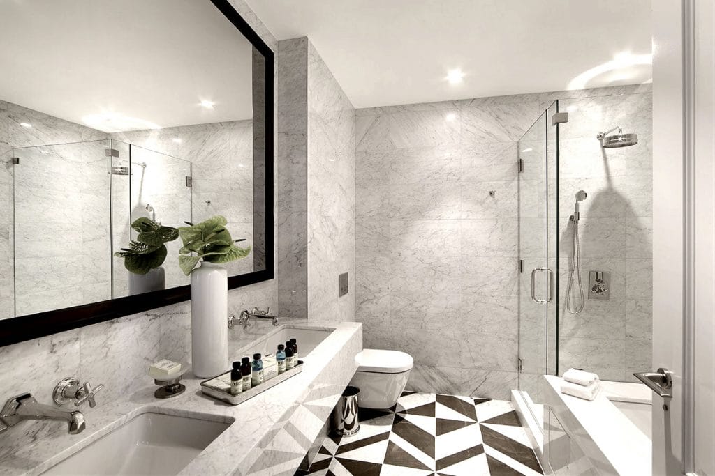 A high-tech bathroom designed with precision and aesthetic appeal by Decorilla designer, Joseph G. 