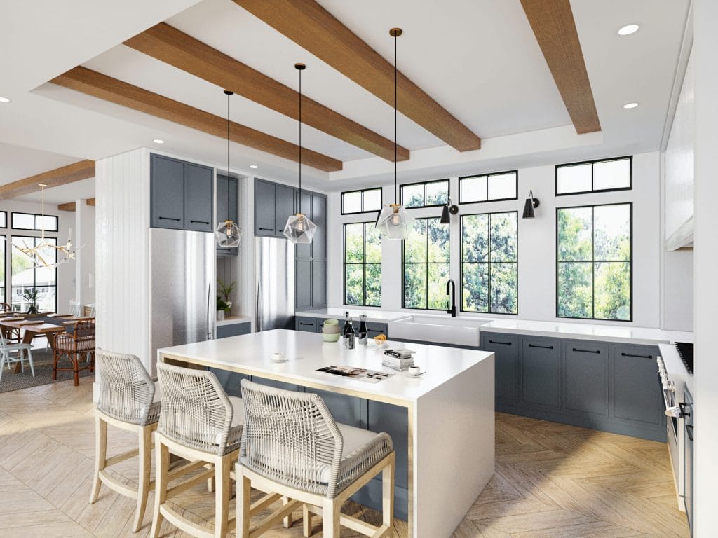 A modern two-tone kitchen featuring blue and white cabinetry, by Decorilla