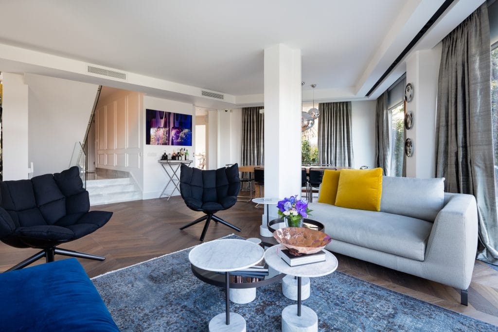 A pair of Husk chairs in a living room by Decorilla designer Meric S.