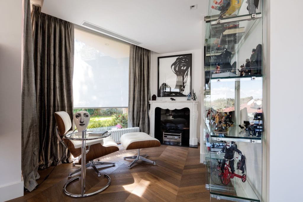 Eames lounge chair in a man cave by Decorilla designer, Meric S.