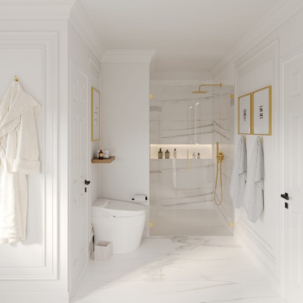 Soft gold details enhance this bright white bathroom by Decorilla