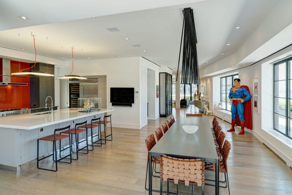 Ultra modern kitchen with red backsplash by Decorilla designer, Susan W. 