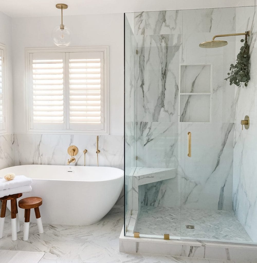 White bathroom with gold hardware by Decorilla