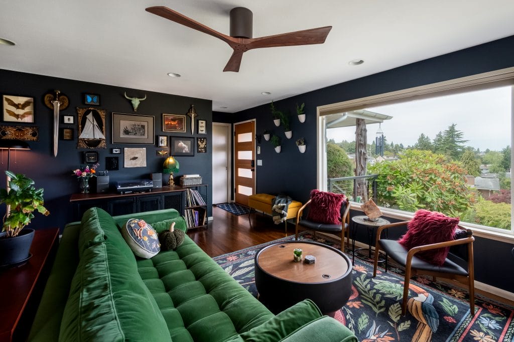 Bold emerald sofa anchors an eclectic living room by Decorilla designer, Jillian M. 