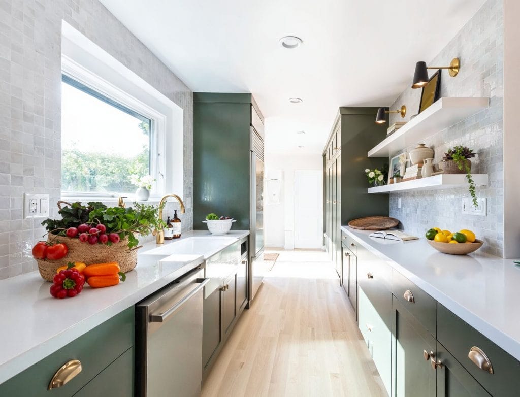 Matte green tones bring subtle charm to this kitchen interior by Decorilla designer Brittney W