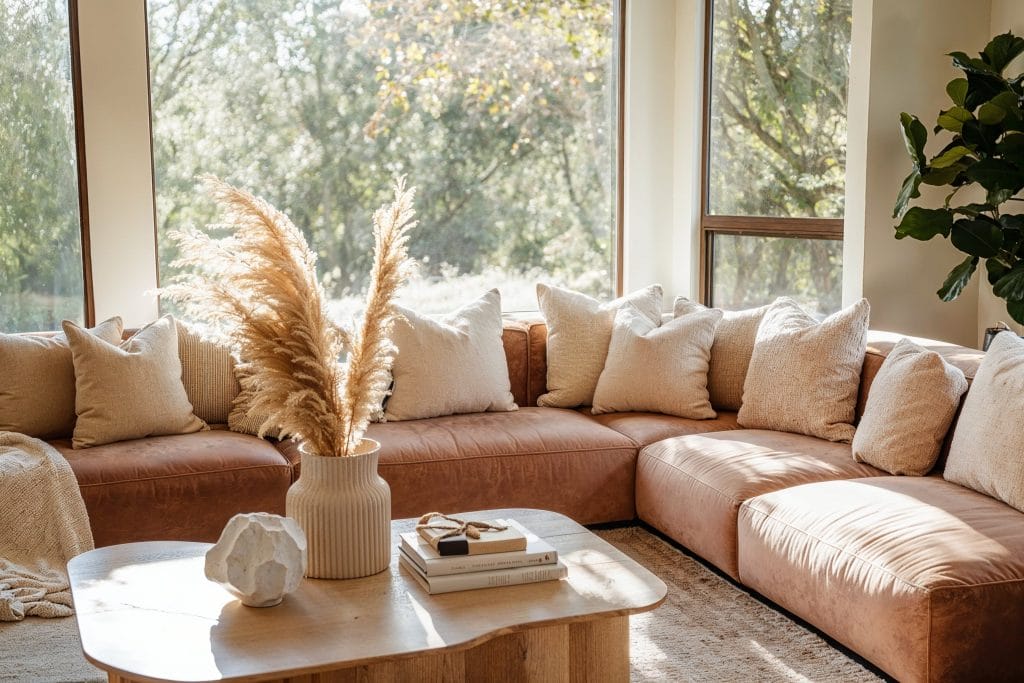 Organic living room with Mocha Mousse sectional sofa by DECORILLA