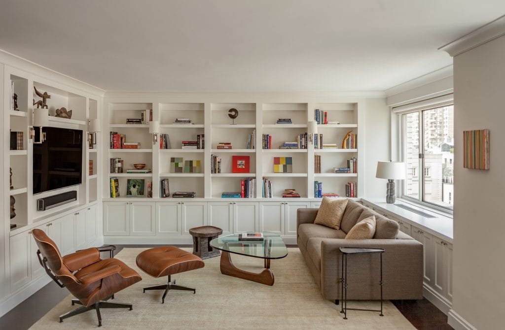 Custom built ins around a TV by Decorilla designer, Leonora M. 