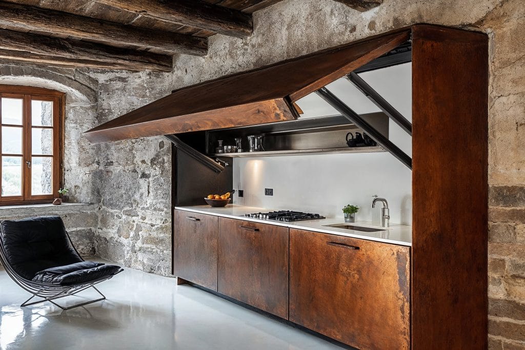 Rustic concealed kitchenette by Decorilla